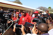 EFF leader Julius Malema and his wife Mantwa Matlala-Malema address the media and supporters after casting their votes at Mponegele Primary School in Seshego.