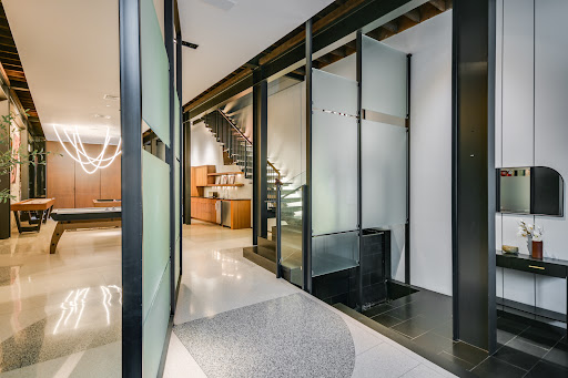 Hallway with staircase and billiard table in this luxury property for sale in Austin ($14,950,000)