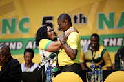 Newly-elected deputy president of the ANC Paul Mashatile and newly-elected deputy secretary general Nomvula Mokonyane embrace after the top leadership of the ANC was elected.