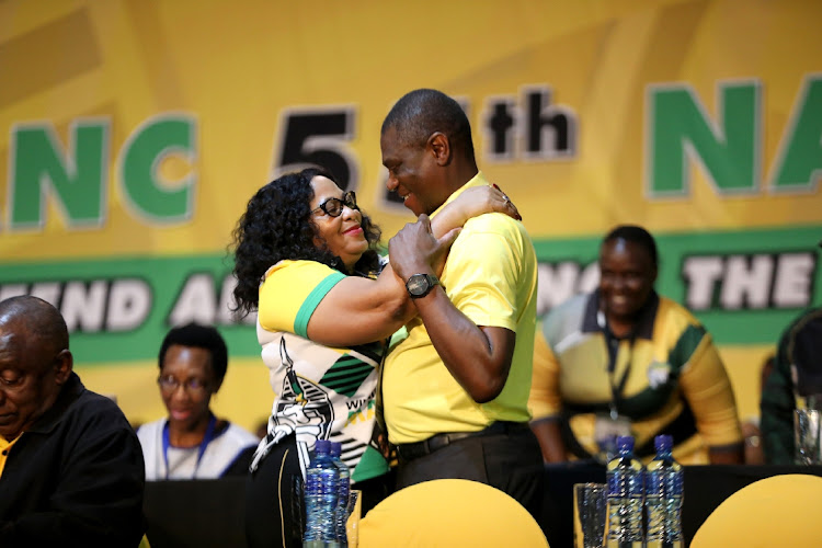 Newly-elected deputy president of the ANC Paul Mashatile and newly-elected deputy secretary general Nomvula Mokonyane embrace after the top leadership of the ANC was elected.