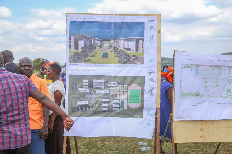 Nyabera residents mill around the plan for the Sh1.8 billion project.