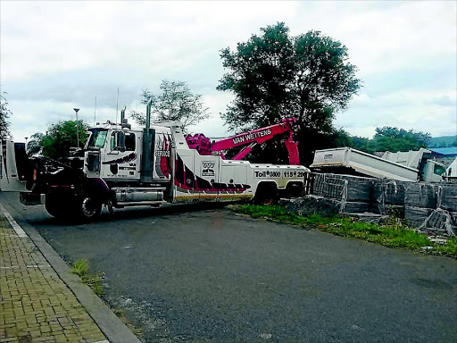 Seized property at the Tubatse/Fetakgomo municipality in Burgersfort, Limpopo, is towed away as the sheriff executes a court decision against the municipality. The mayor's Range Rover was also attached. photo: supplied