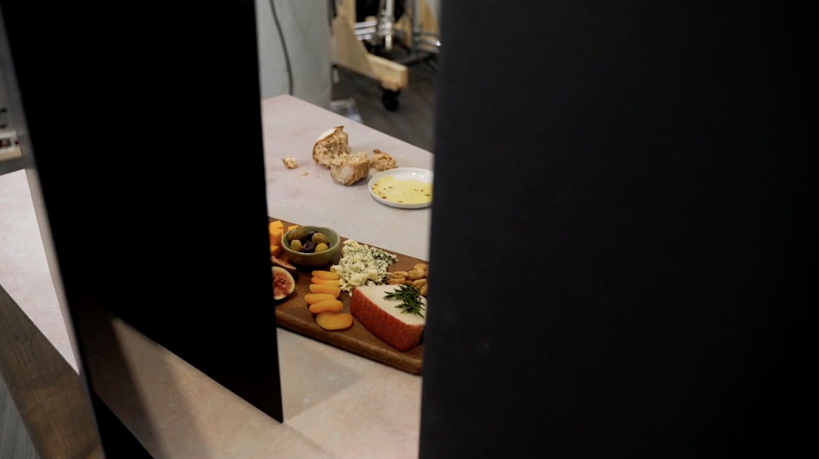 Using black tabletop V-Flats to create dark shadows in food photography.