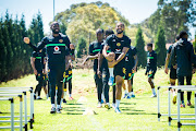 Ramahlwe Mphahlele and Reeve Frosler share a light moment at the Kaizer Chiefs training base yesterday ahead of tomorrow’s match against Chippa United in Gqeberha.