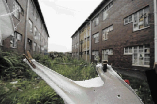 airing laundry: The abandoned Central Secondary State School in Soshanguve, Pretoria, has turned into a place where people live PHOTOS: ANTONIO MUCHAVE