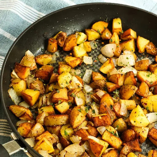 Home Fries are cubed potatoes that are pan-fried crisp on the outside, smooth and creamy on the inside, and seasoned simply with common pantry spices and seasonings.

