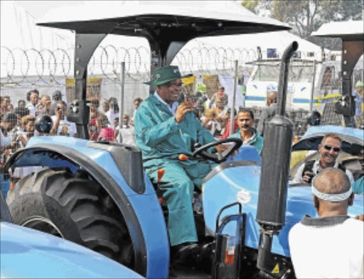 SERVICE DELIVERY: President Jacob Zuma with one of the tractors he handed out to residents in Peddie.