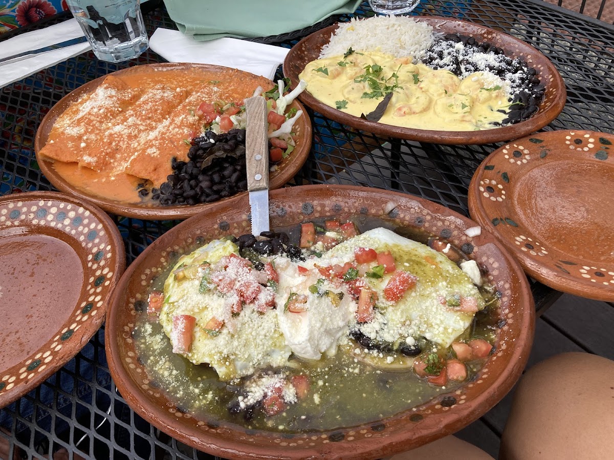 Sopes huevo, left is enchiladas puya, right is the shrimp in cream saice