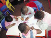 CREATIVE MINDS:
Children at the
Villa of Hope
educentre show
off their talents
in art by drawing
and painting
pictures.
Pic: Lindi Obose. Circa August 2009. © Sowetan.