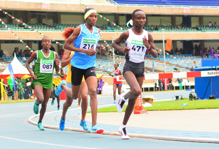 Monica Wanjiru leads Alice Aprot in the 10,000m race during the Kenya Prisons athletics championships at the Moi Stadium, Kasarani. PHOTO/ ERICK BARASA