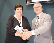 Melissa Whitehead receives an award in 2015 from Sir Peter Hendy, president of the International Association of Public Transport. 