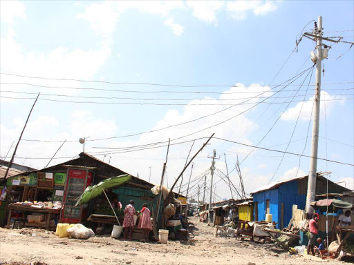 Electricity pole with wire connection from it to different houses in Mukuru Kwa Reuben slums. PHOTO/COLLINS KWEYU