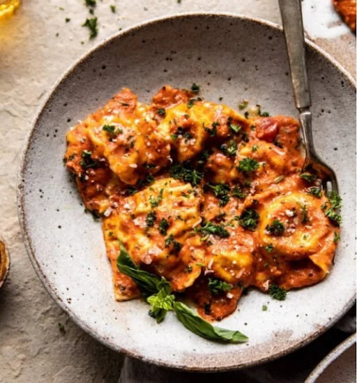 Ravioli In Creamy Tomato Basil Sauce