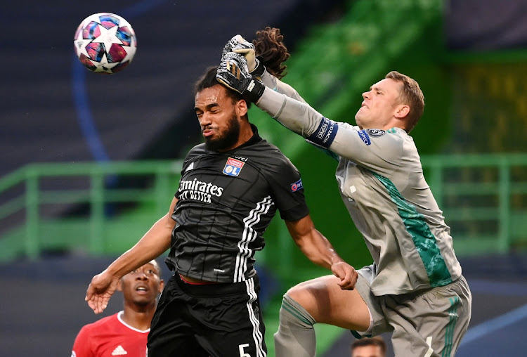 Olympique Lyonnais' Jason Denayer contests possession with Bayern Munich's goalkeeper Manuel Neuer during their Champions League semifinal at Jose Alvalade Stadium, Lisbon, Portugal on August 19, 2020