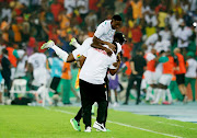 Guinea's Amadou Diawara celebrates with teammates after their Africa Cup of Nations last 16 win against Equatorial Guinea at Olympic Stadium of Ebimpe in Abidjan, Ivory Coast on Sunday night.