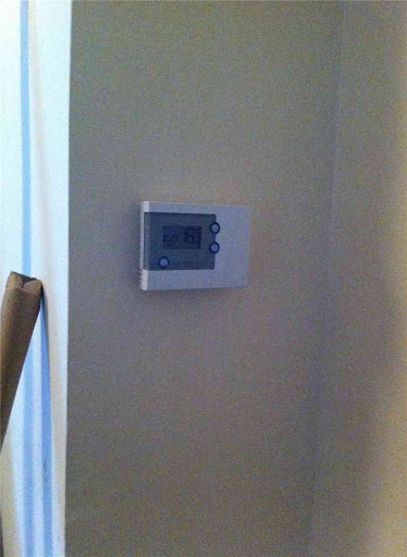 A wireless programmable room stat was fitted to comply with Building Regs