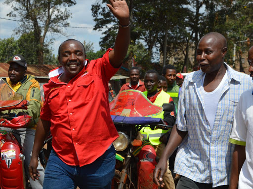 Kiambu Mp Jude Njomo with Kiambu residents during last minute campaigns of Jubilee party nominations being held today. He asked the Jubillee party officials conducting the primaries to be on the look out of dubious ways being used to rig the nominations