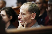 Professor Sean Davison sits in the gallery at the Cape Town Magistrates' Court.