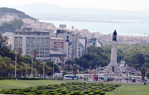 lisbon-overlooking-harbor-1.jpg - Financial district area of Lisbon, Park  with a hedge Maze, looking down to port, and river, tower sculpture.