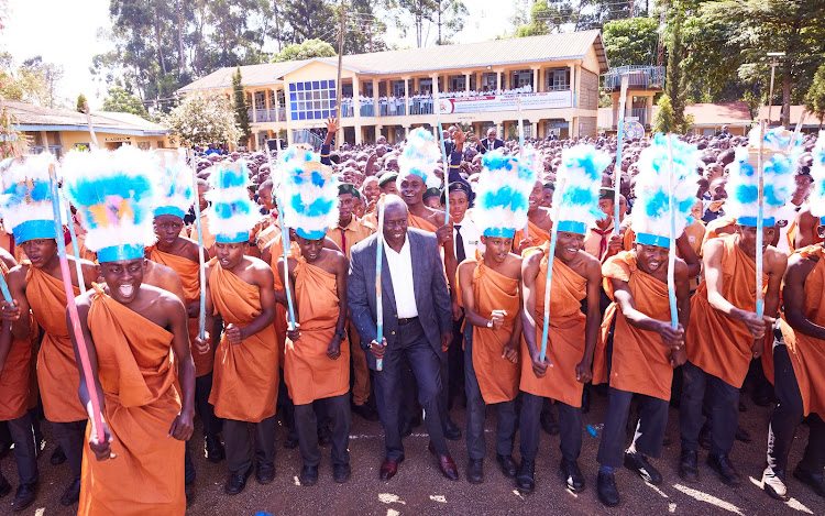 Deputy President Rigathi Gachagua interacts with students at his former school, Kianyaga Boys High School in Kirinyaga County on February 9, 2023