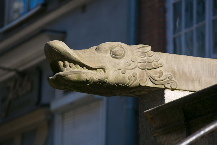 A dragon carving on a historic street in Old Gdansk, Poland. 