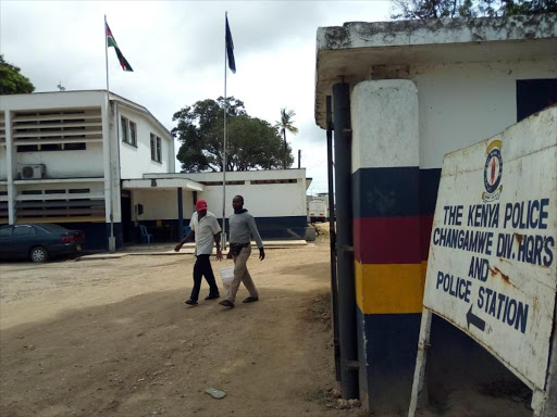 Men walk out of Changamwe police station where Caleb Espino Otieno died on Tuesday, September 20, 2018. /ERNEST CORNEL