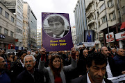 Demonstrators gather on the spot where Turkish-Armenian journalist Hrant Dink was killed, during a commemoration to mark the 12th anniversary of his death, in Istanbul, Turkey January 19, 2019.