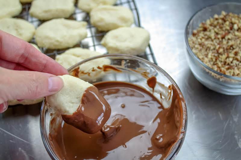 Dipping The Cookies In Chocolate.