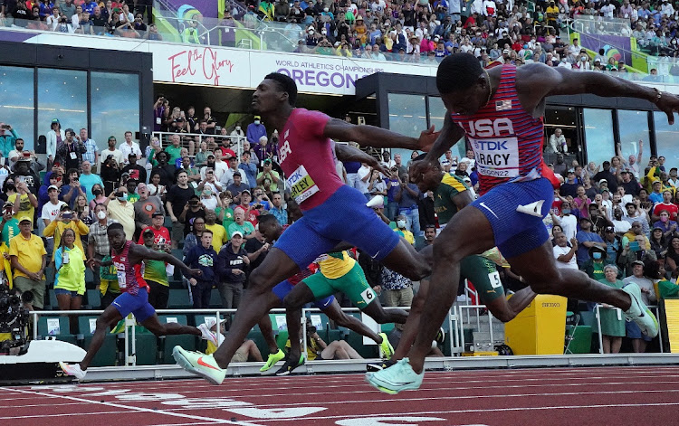 Fred Kerley of the US crosses the line to win the men's 100 metres final ahead of Marvin Bracy and Trayvon Bromell. Akani Simbine can be seen between Kerley and Bracy.