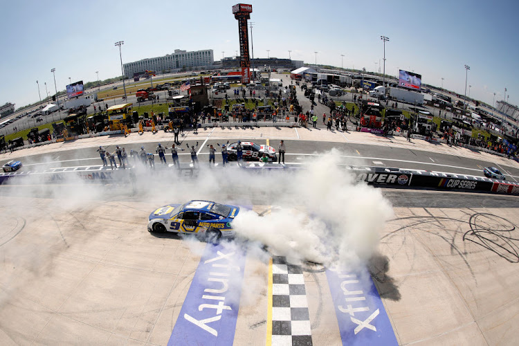 Chase Elliott, driver of the #9 NAPA Auto Parts Chevrolet, celebrates with a burnout after winning the NASCAR Cup Series DuraMAX Drydene 400 presented by RelaDyne at Dover Motor Speedway on May 02, 2022 in Dover, Delaware.