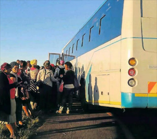 NO HOLDING BACK: Khwetyana residents stood their ground against taxi drivers who were allegedly refusing to let them commute in buses. They staged a march yesterday morning Picture: SUPPLIED