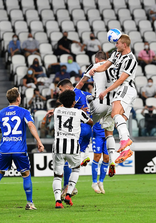 Juventus' Netherland's defender Matthijs de Ligt (R) heads the ball during the Italian Serie A football match against Empoli at Allianz Stadium in Turin, on August 28, 2021.