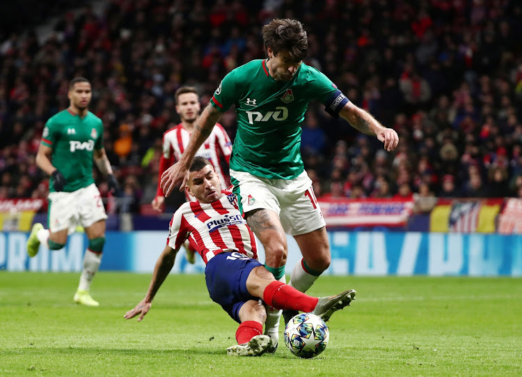 Lokomotiv Moscow's Vedran Corluka in action with Atletico Madrid's Angel Correa