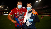 Willem Alberts of the Lions with Sharks physiotherapist Deane Macquet during the Super Rugby Unlocked match at Kings Park on October 9 2020 in Durban. 