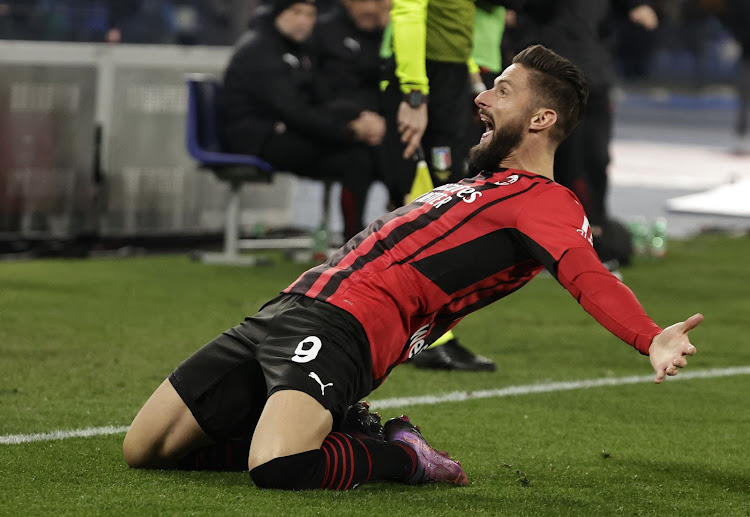 AC Milan's Olivier Giroud celebrates after scoring against Napoli