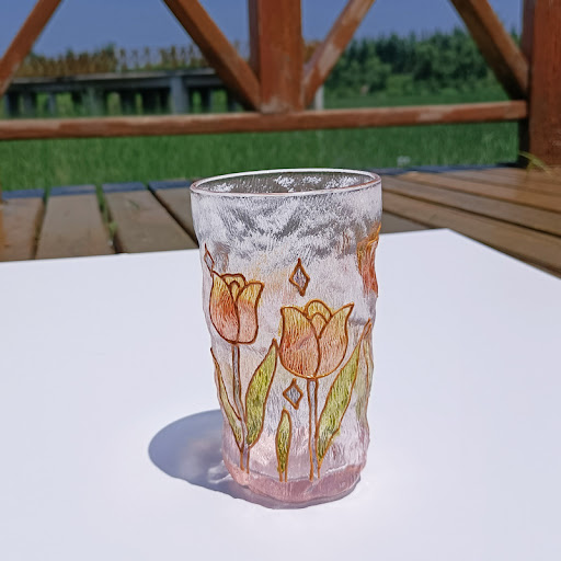 Title 10, Gold-painted hammered crystal glass cup with ar...