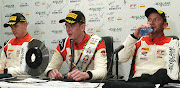 Newly-crowned Intercontinental GT champion Dennis Olsen (centre) with Porsche teammates Mathieu Jaminet (left) and Nick Tandy.