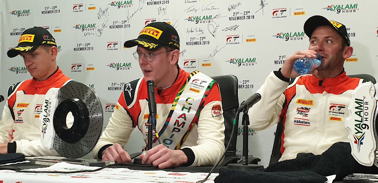 Newly-crowned Intercontinental GT champion Dennis Olsen (centre) with Porsche teammates Mathieu Jaminet (left) and Nick Tandy.