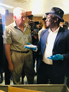 Chris van der Bergh with minister Bheki Cele during the handover.