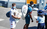 Frances Tiafoe (right) of the US and coach Wayne Ferreira arrive for a training session at Melbourne Park ahead of the 2021 Australian Open.