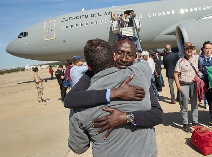 An evacuee is embraced after disembarking from a Spanish Air Force plane at Torrejon de Ardoz air base in Spain, April 24 2023. Picture: SPANISH FOREIGN MINISTRY/REUTERS