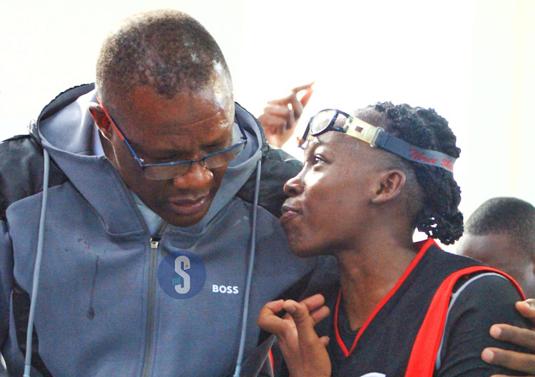 ICT CS Eliud Owalo, the tournament's patron embraces Zetech Sparks MVP Cameroonian Mitchelle Soukoujou after they clinched the first place in the women's category on May 12, 2024.