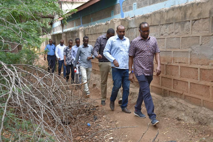 Garissa Urban Planning executive Abdi Omar [in front] when he made an impromtu tour of the Garissa ASK Showground on Saturday, March 21, 2020