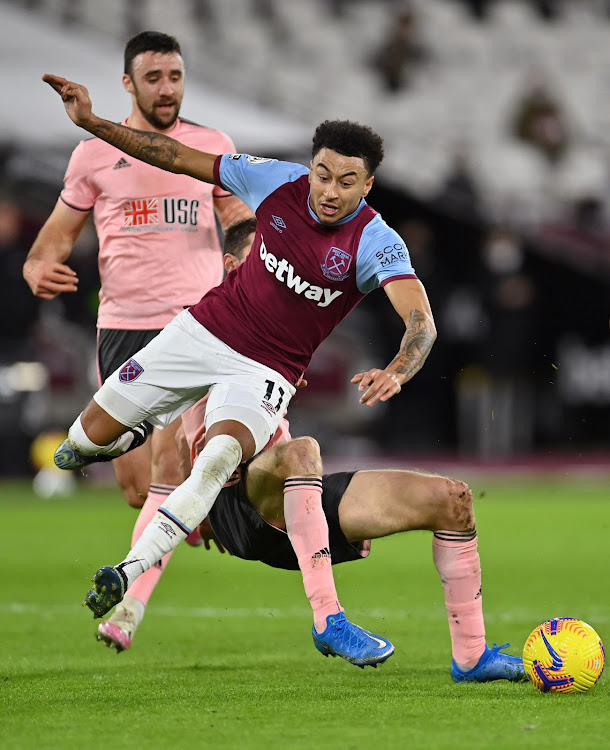 West Ham United's Jesse Lingard is fouled by Sheffield United's Chris Basham