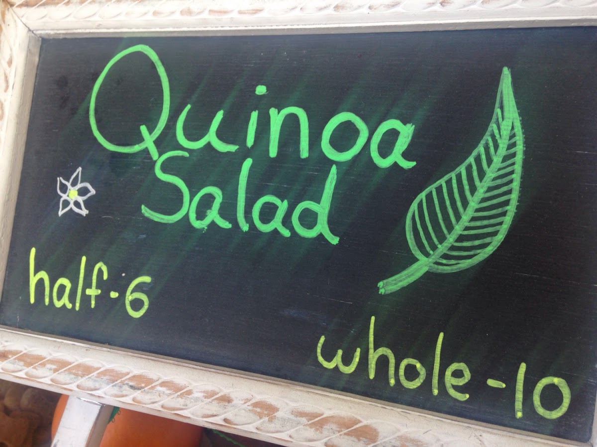 Quinoa on a bed of spinach with carrots, onion, zucchini, bell pepper, parsley, tomatoes, with lemon olive oil dressing.