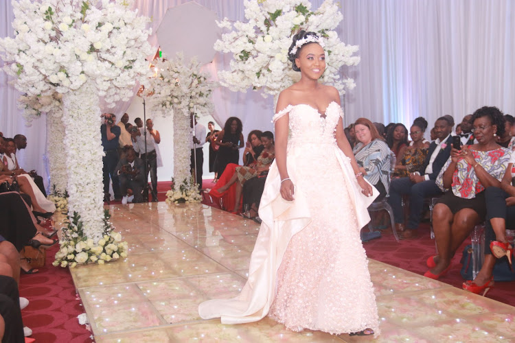 Diana Njoki models in a bridal wedding dress