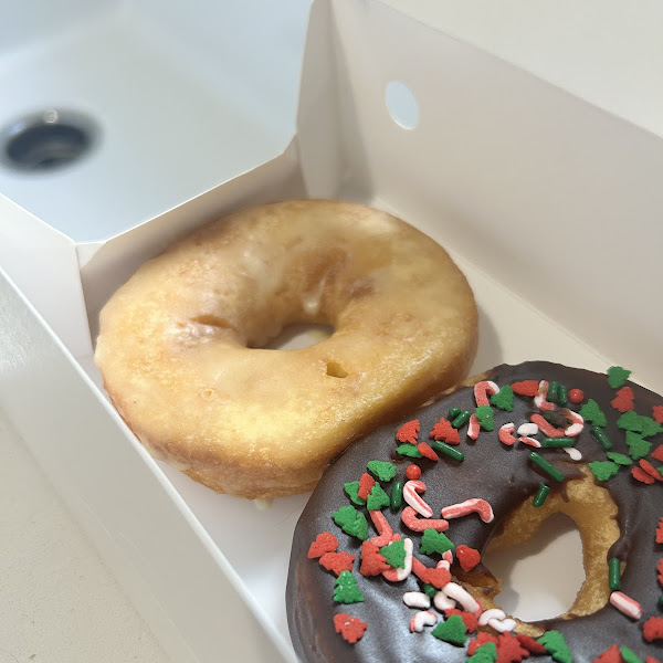 Gluten free regular glazed donut + chocolate glazed with holiday sprinkles