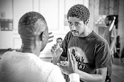 Alfred Enoch and fellow cast members rehearse 'Tree' before it premieres at the Manchester International Festival. 