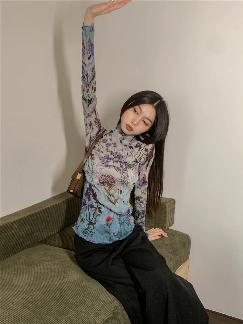 Women's irregular pleated printed Tencel top. Experience comfort and style with this soft, breathable, and unique design