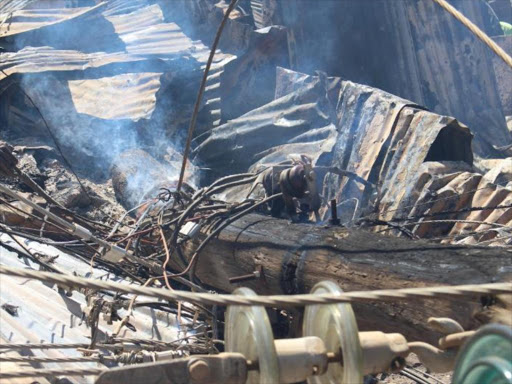 An electricity pole which fell following a fire at Kijiji slum in Lang'ata, Nairobi, January 28, 2018. /Ezekiel Aming'a